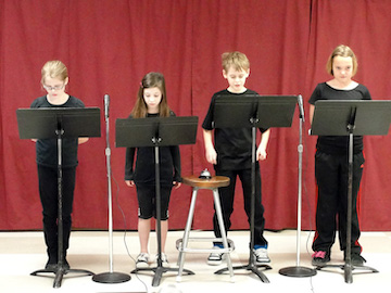 children performing readers theatre