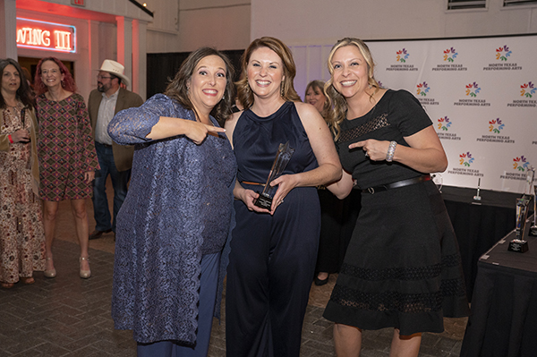 Patricia Gregory poses with board members for a picture after receiving an award at Celebration of Champions