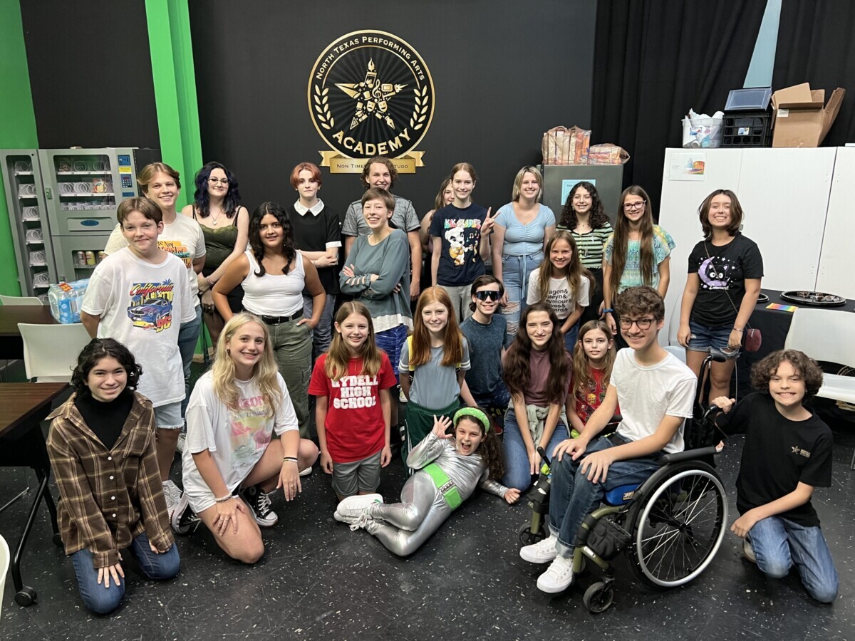 Class photo of 2022 Academy students in front of the NTPA Academy Crest